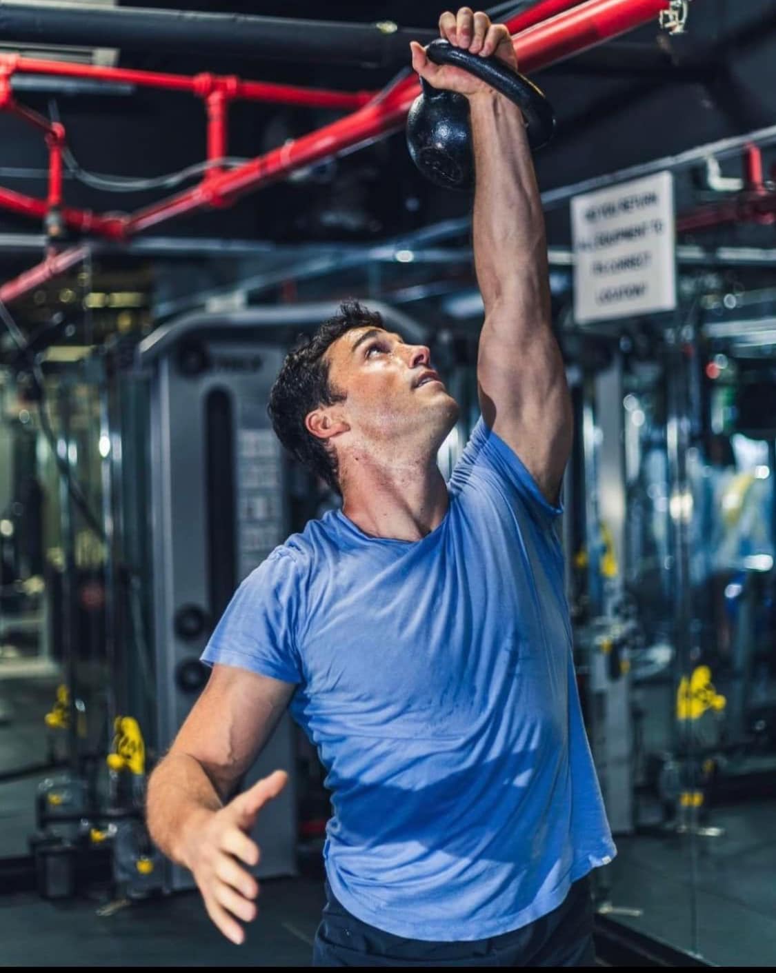 Pat lifting weights at Tone and Muscle gym